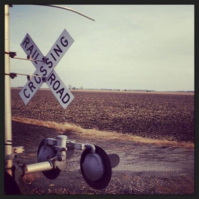 rail road crossing somewhere in in the deep american countryside.